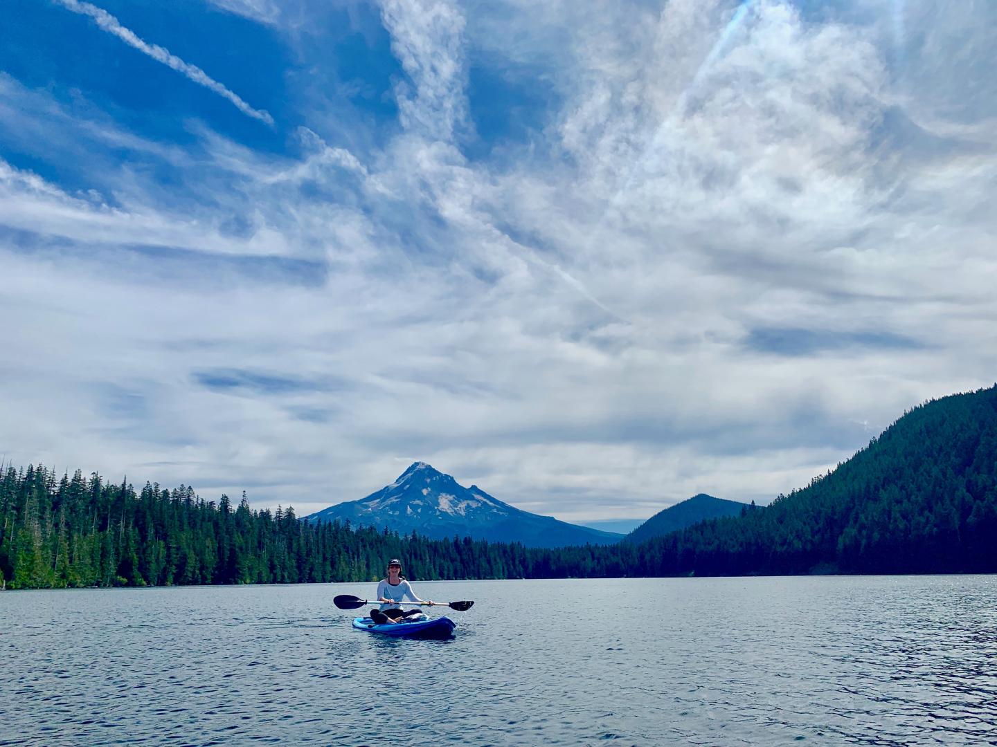 A person on a kayak on a lake